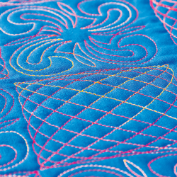 Example of thread in a blue quilt