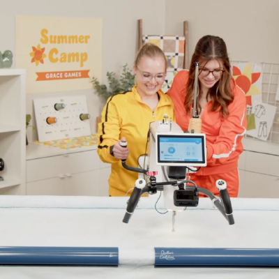 Grace Company Digital Quilting Educators with a Longarm Quilting Machine