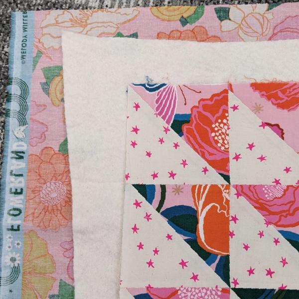 How your backing, batting, and top quilt should look when layered.